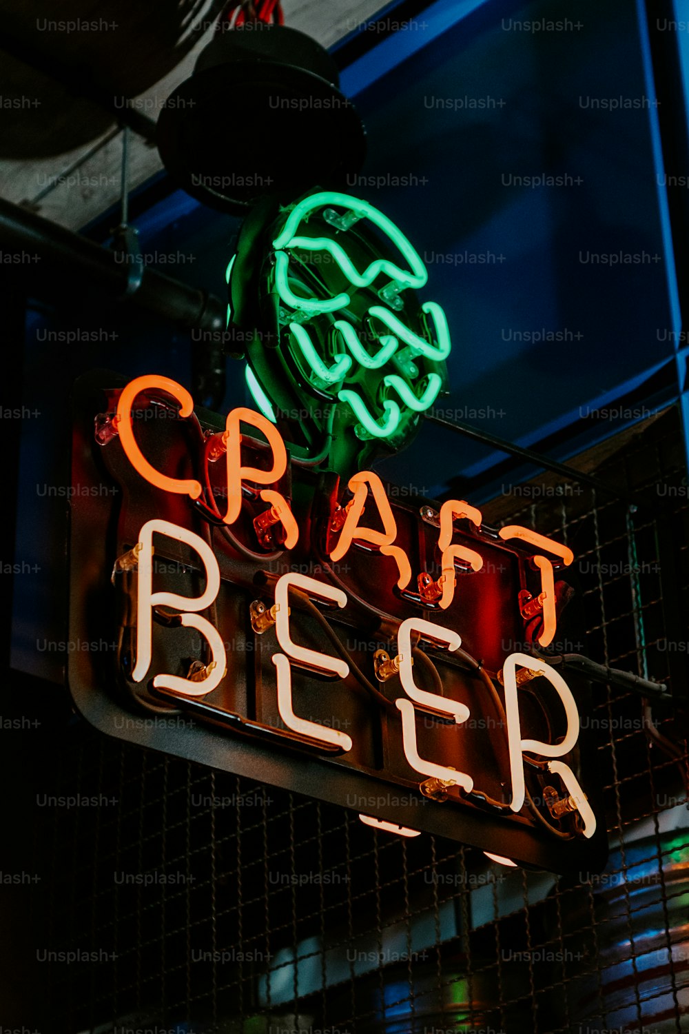 a neon sign that reads craft beer