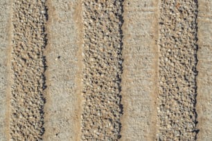 a close up of a sand and gravel surface