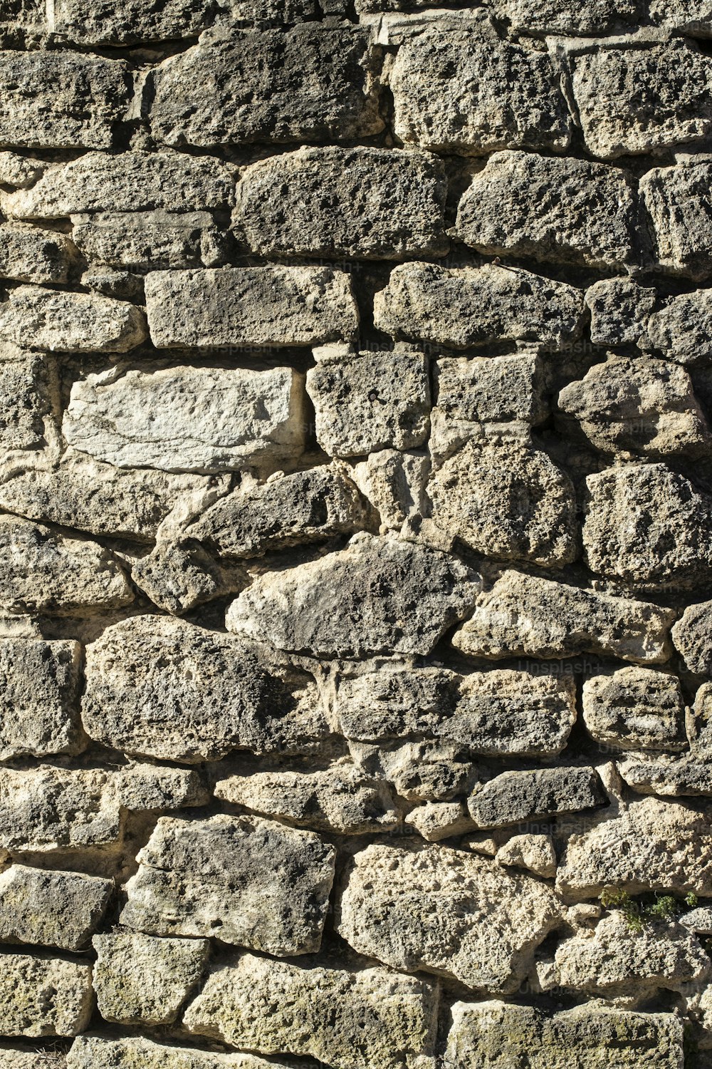 a close up of a stone wall made of rocks