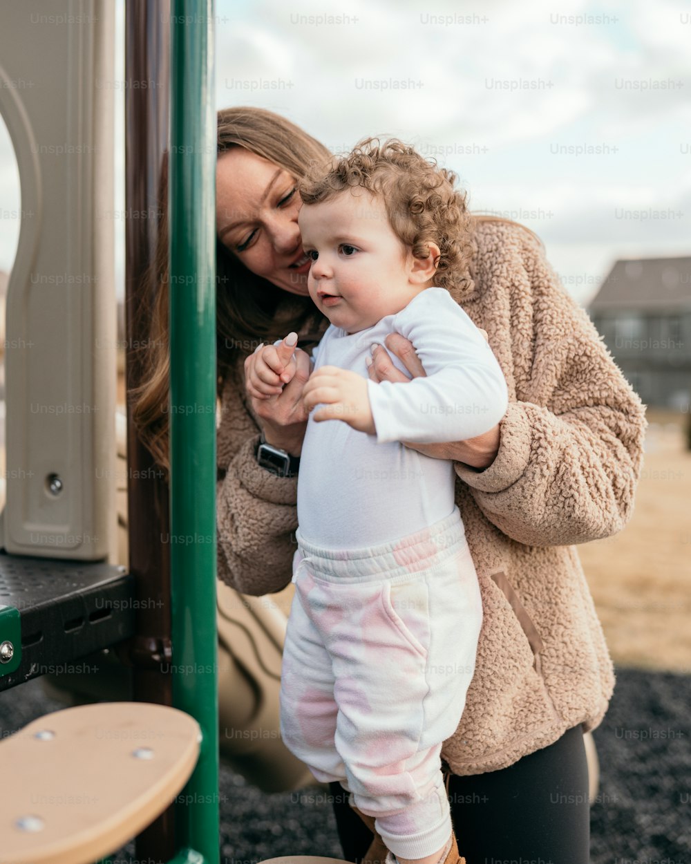 a woman holding a baby in her arms