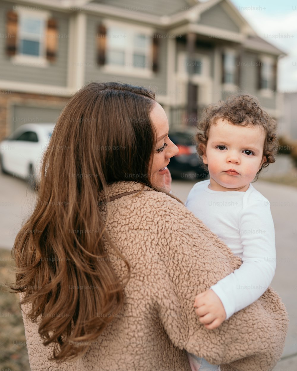 a woman holding a small child in her arms