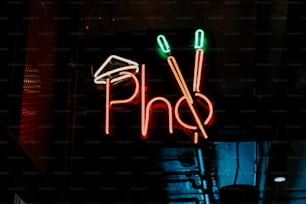 a neon sign that says pho on it