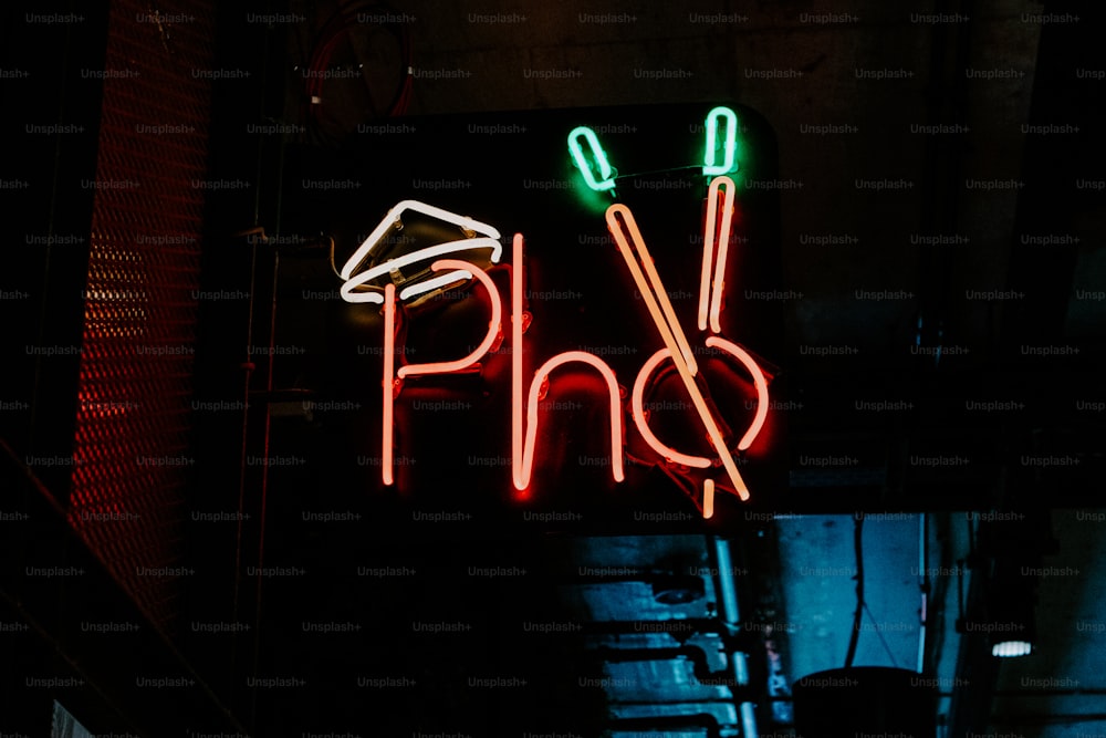 a neon sign that says pho on it