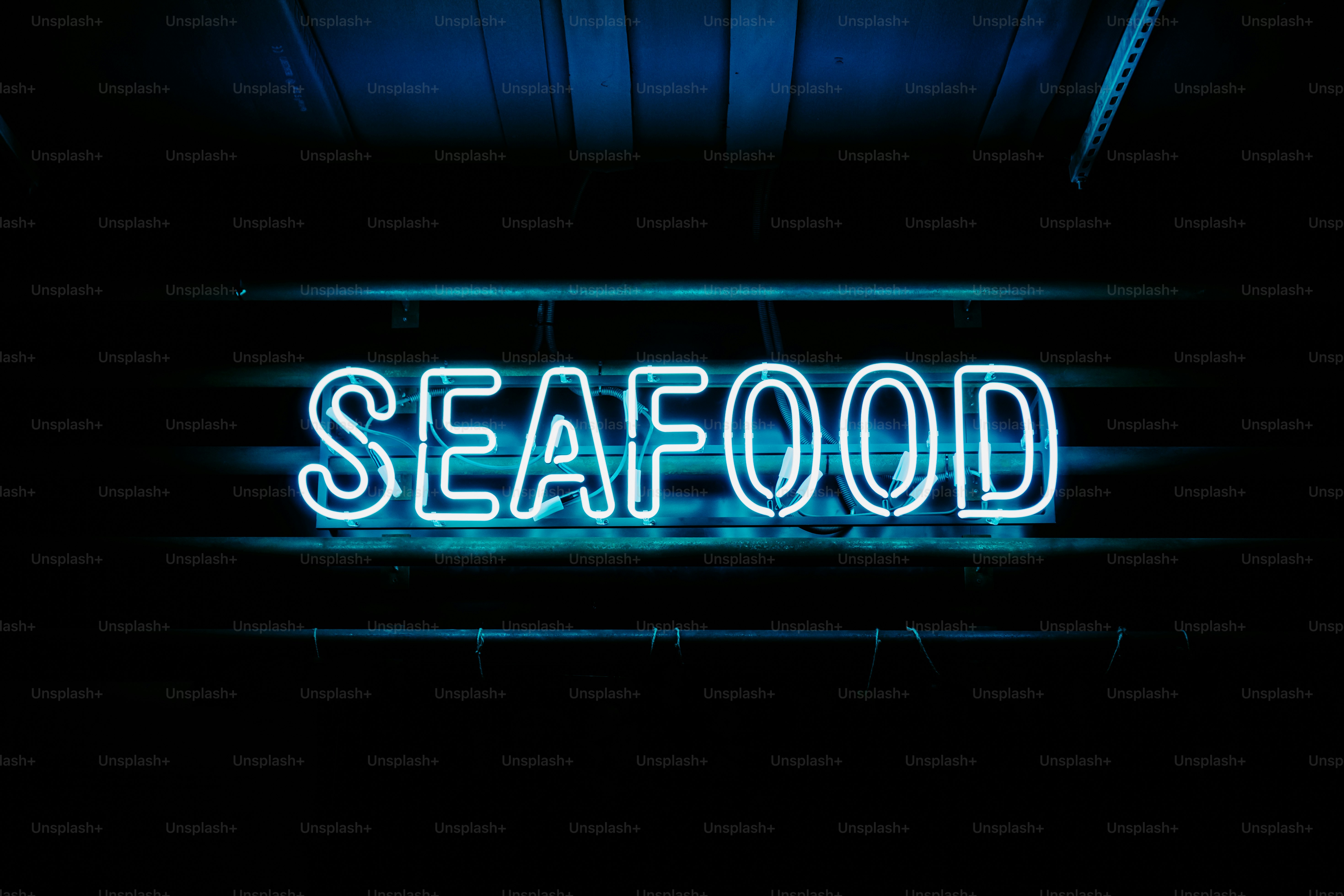 a neon sign that says seafood on it