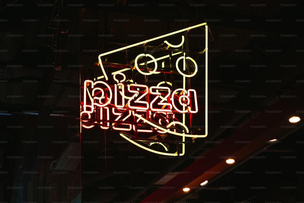 a neon sign hanging from the side of a building