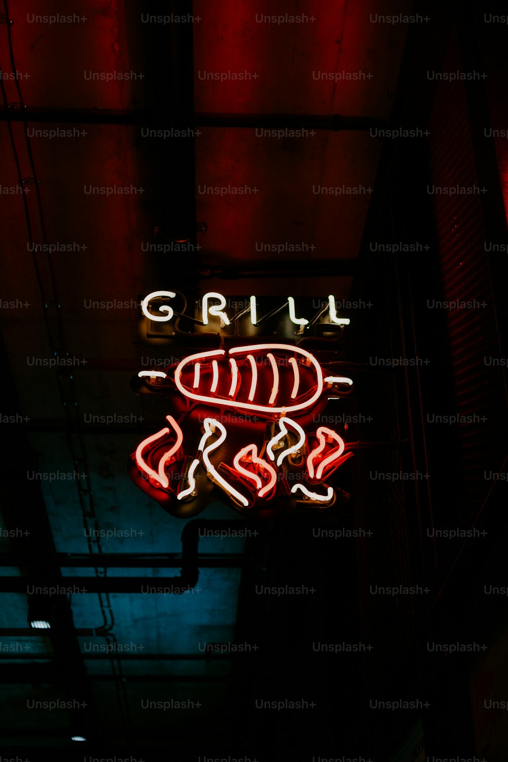 a neon sign that reads grill boss