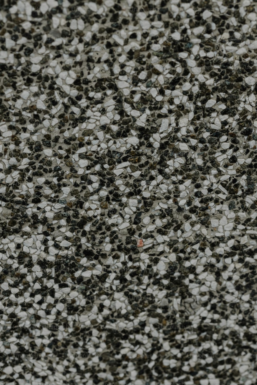 a close up of a black and white speckled surface