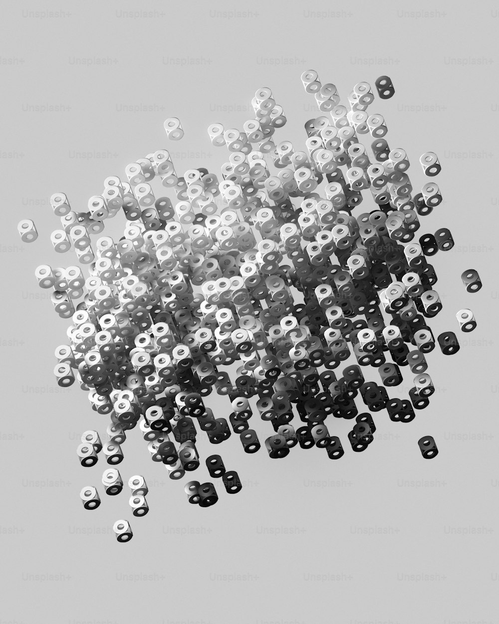 a bunch of small black and white objects floating in the air