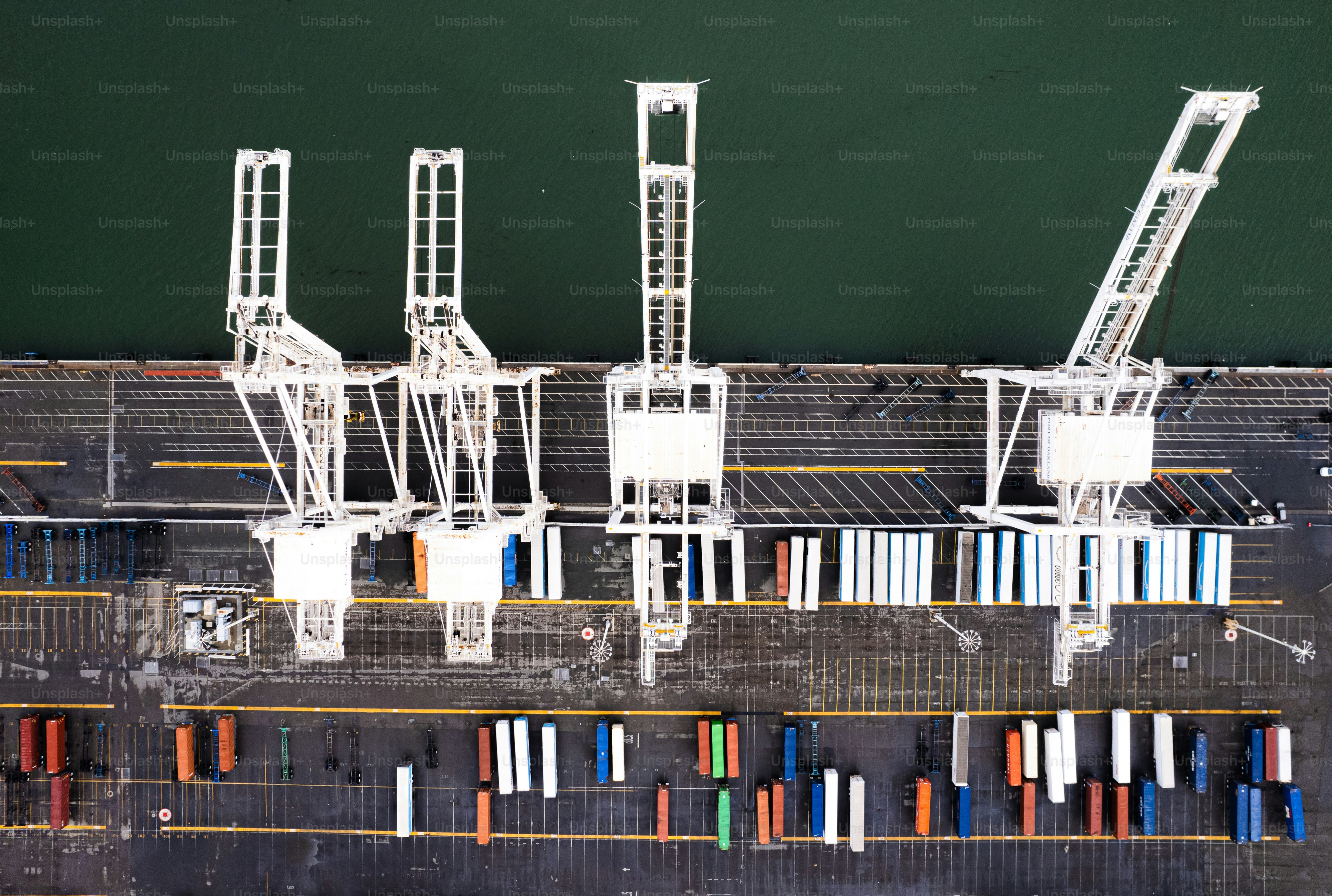 an aerial view of a dock with a boat in the water