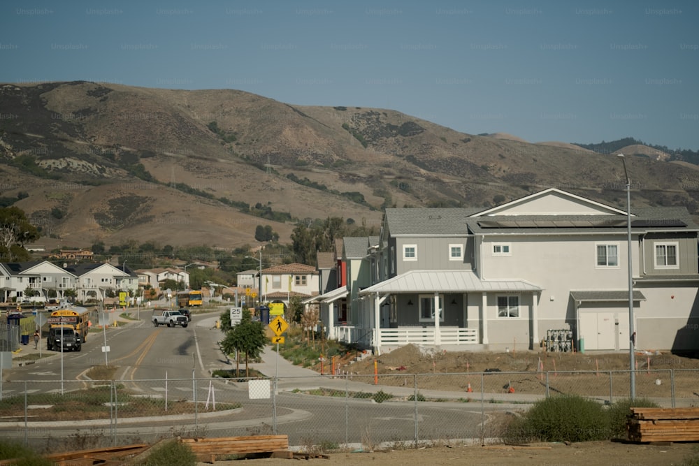 a view of a town with a mountain in the background