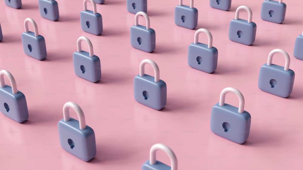 a group of padlocks on a pink surface