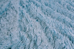 an aerial view of a large glacier wall