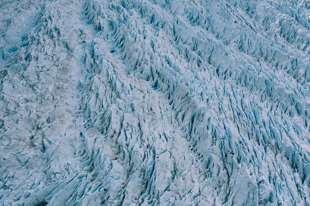 an aerial view of a large glacier wall