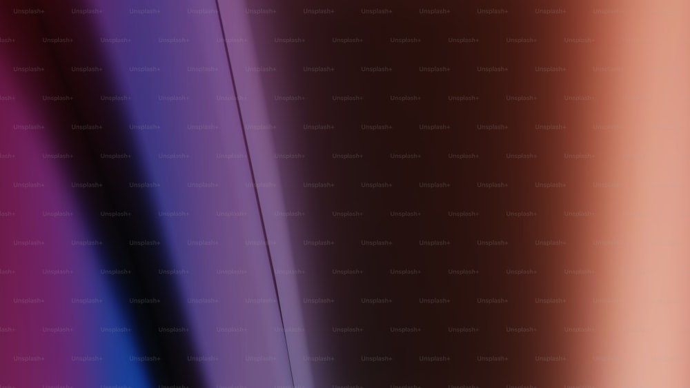 a blurry image of a red, purple, and blue background