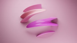 a purple and pink object on a pink background
