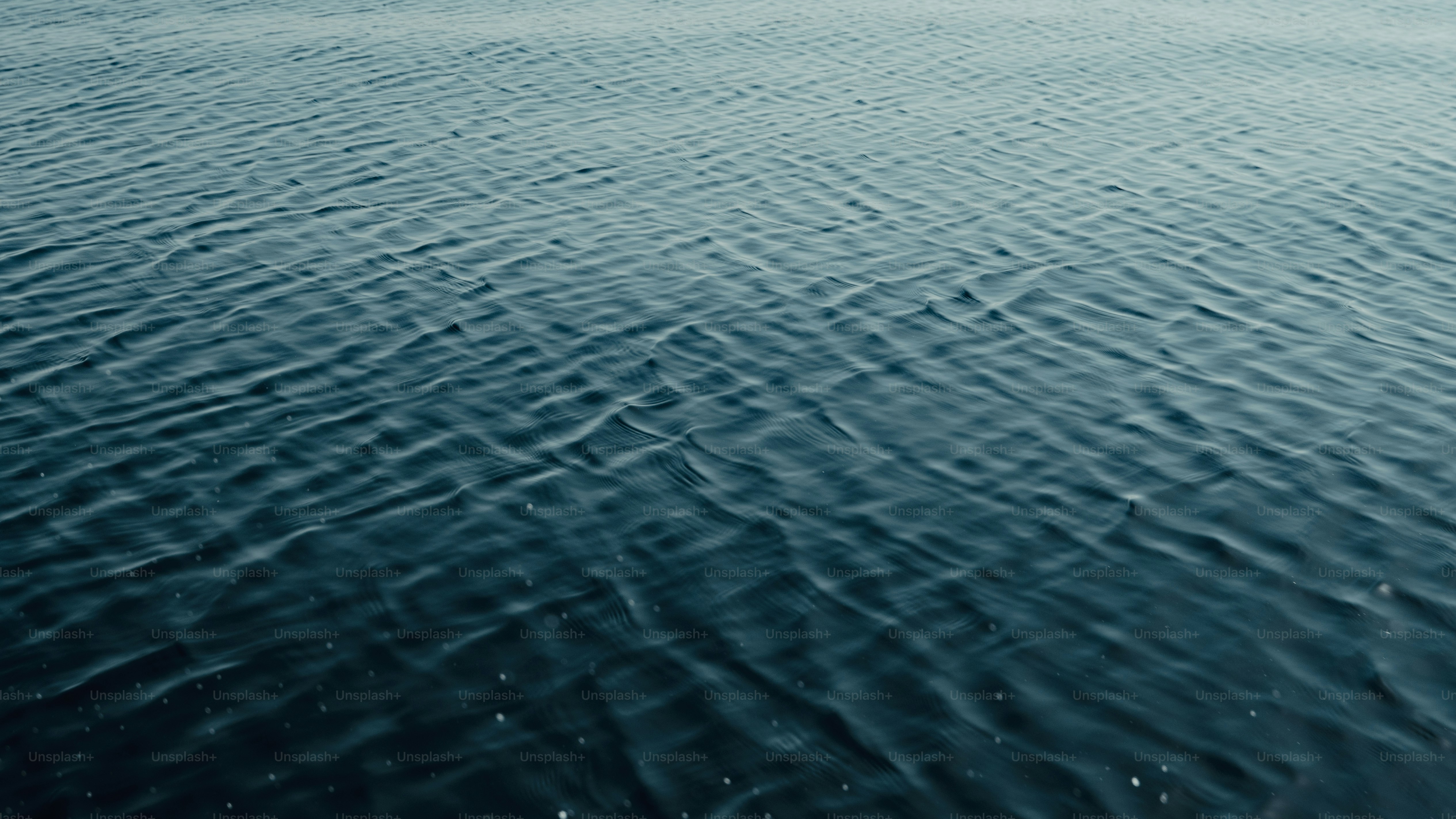 a large body of water with ripples in it