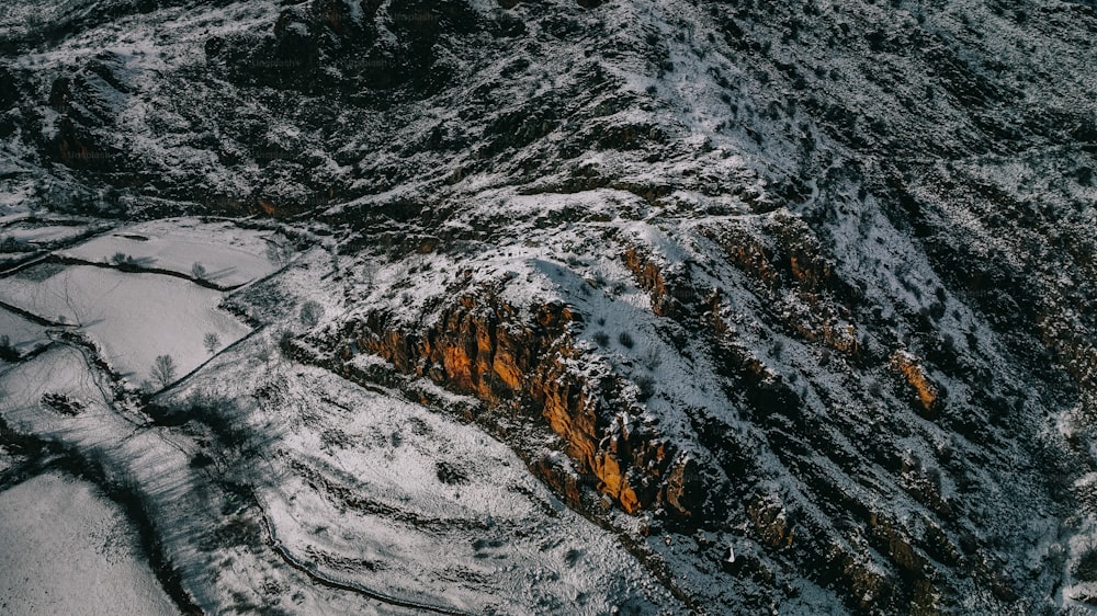 an aerial view of a snow covered mountain