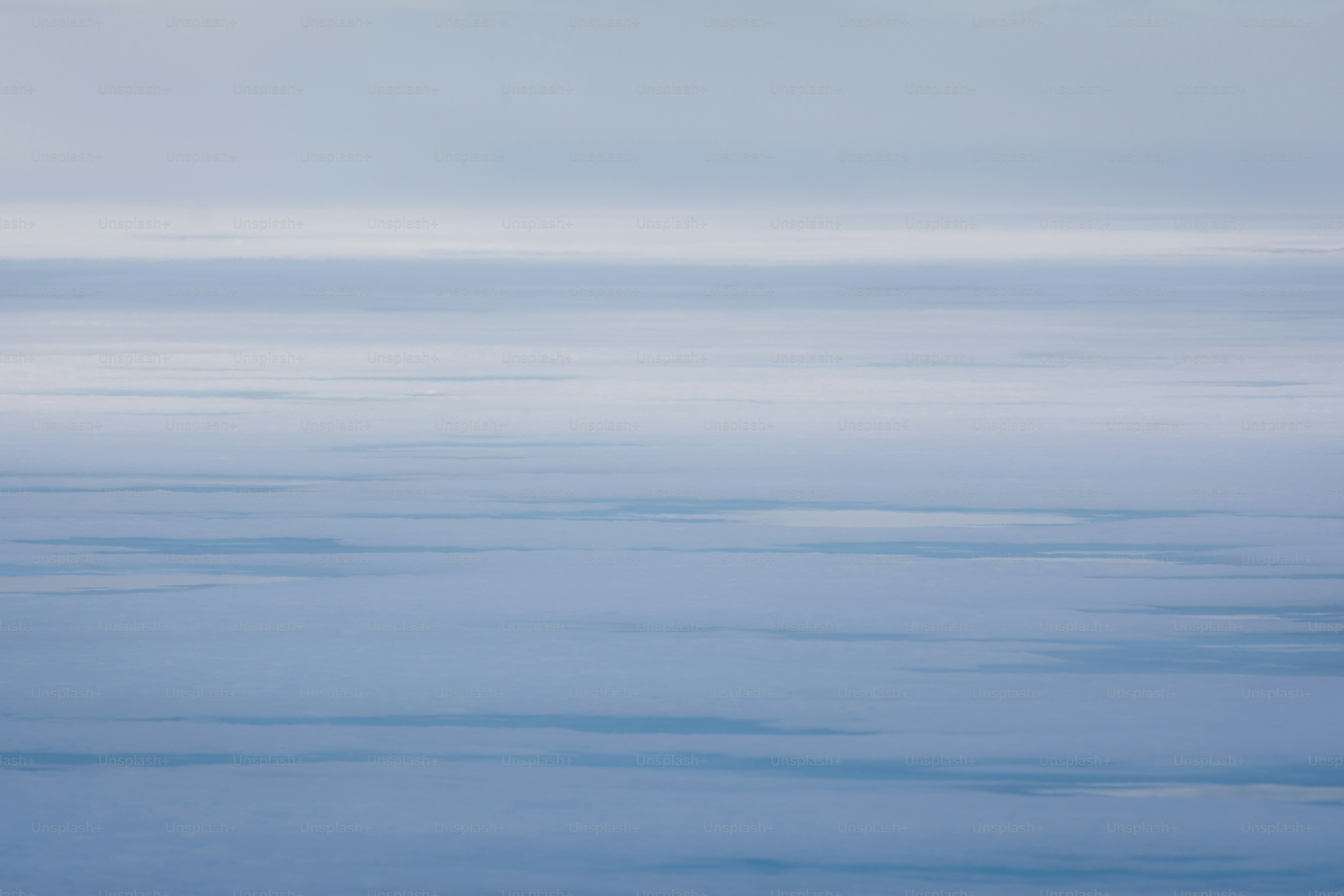 a plane flying over a large body of water