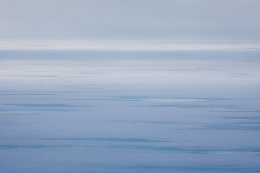 a plane flying over a large body of water