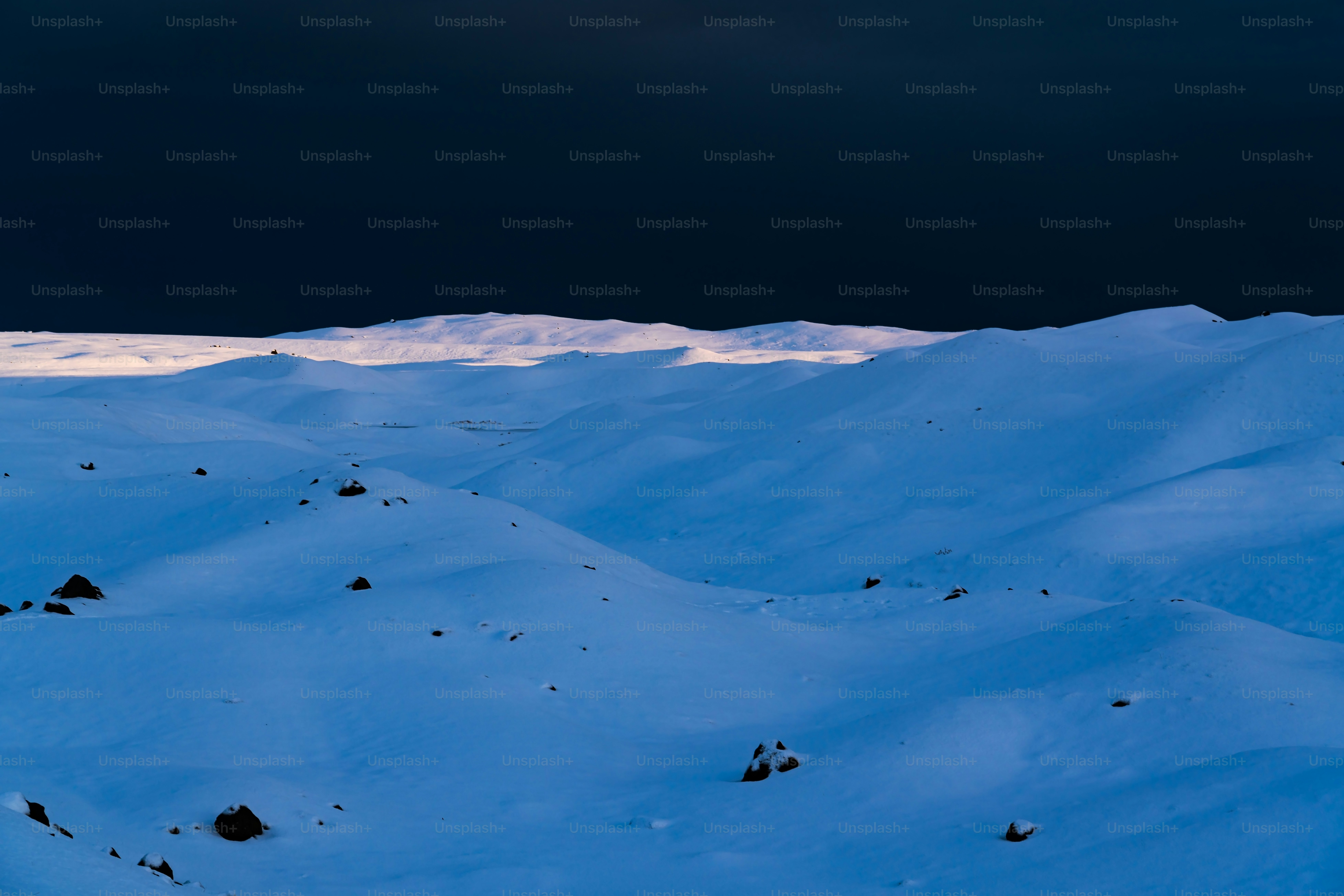 a person riding skis on top of a snow covered slope