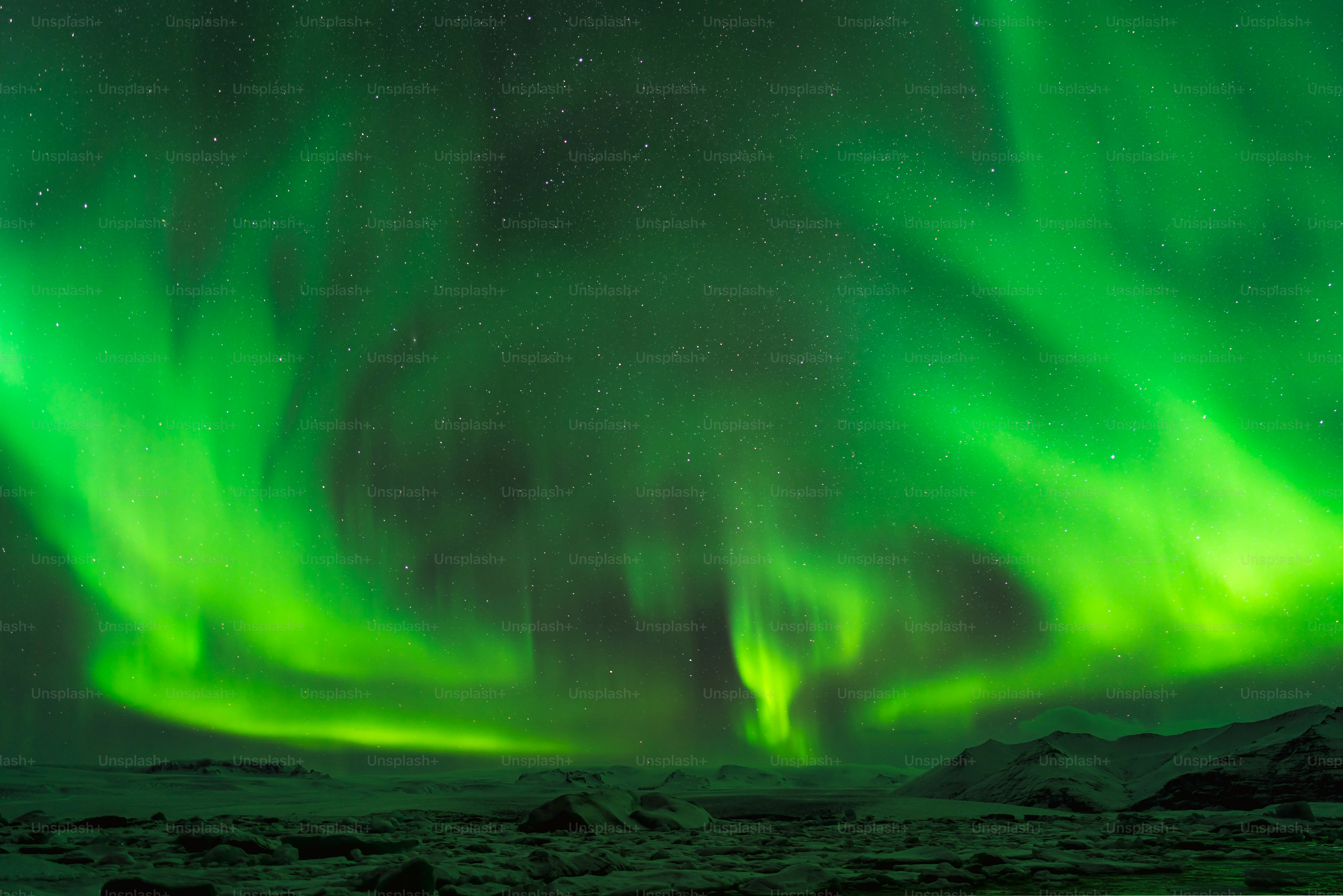 a green and purple aurora bore in the night sky