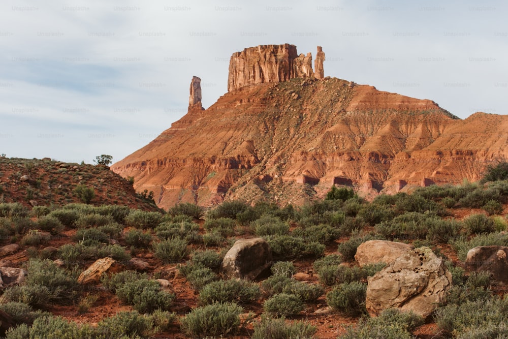 a large rock formation in the middle of a desert