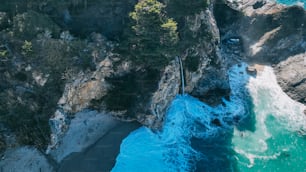 an aerial view of the ocean and cliffs