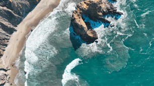 an aerial view of a beach and a cliff