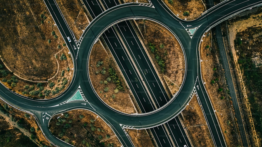 an aerial view of a highway intersection with multiple lanes