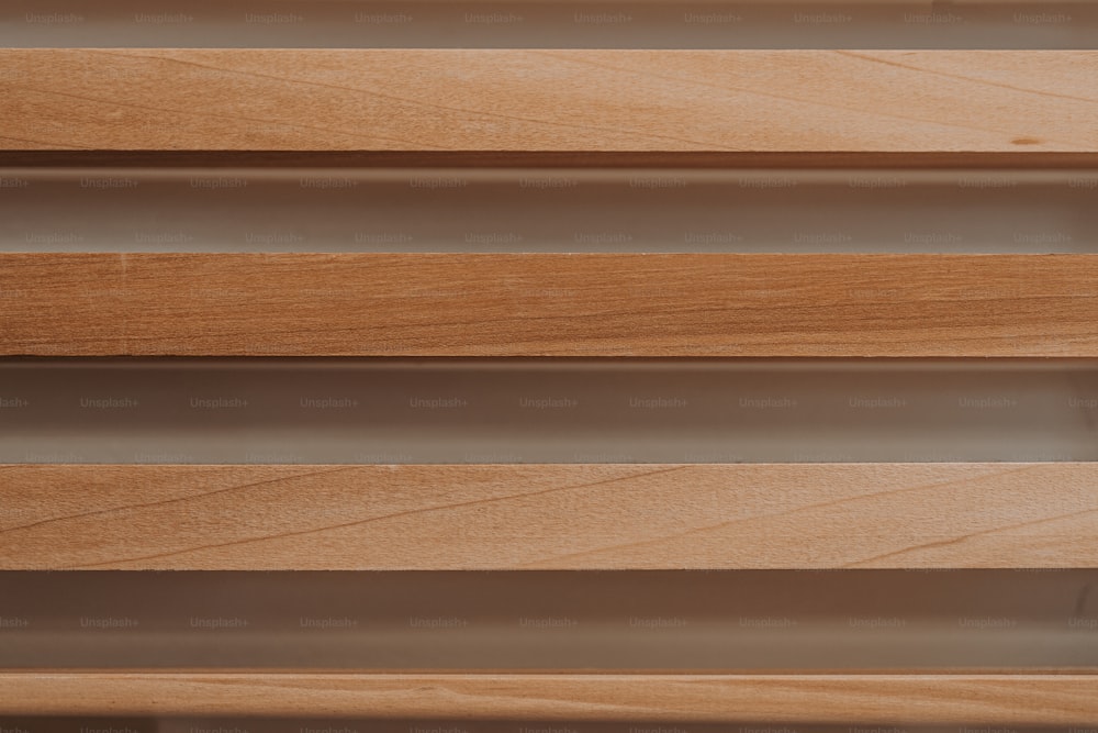 a close up view of a wooden shelf