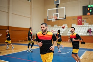 a group of men playing a game of basketball