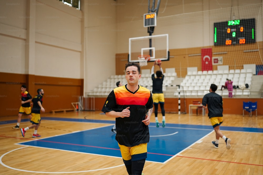 a group of men playing a game of basketball