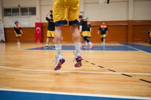 a group of people playing a game of basketball