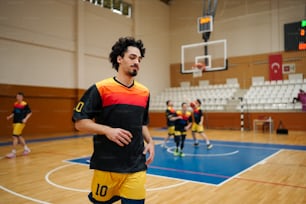 a group of men playing a game of basketball