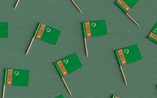 a group of green flags that are on a stick