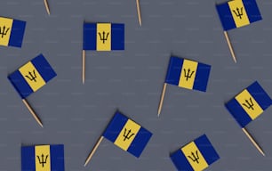 um grupo de bandeiras azuis e amarelas em paus