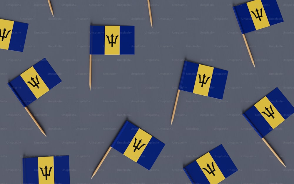 a group of blue and yellow flags on sticks