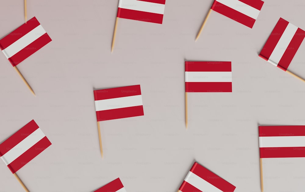 a group of small red and white flags on toothpicks