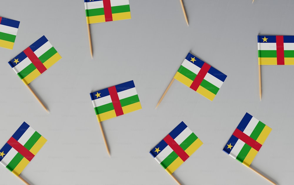 a bunch of flags that are on a stick