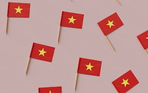a group of red and yellow flags on sticks