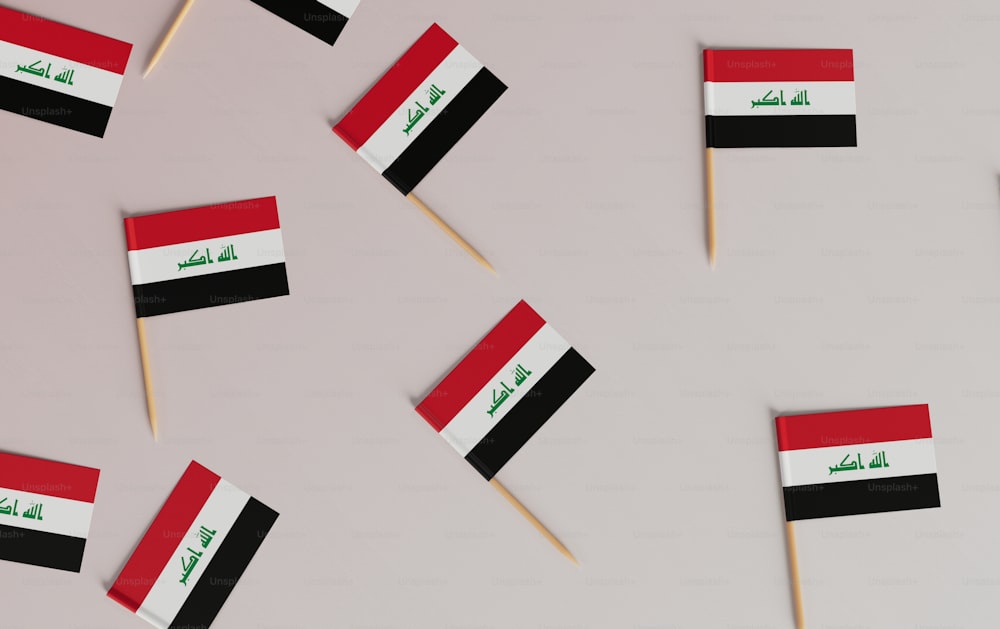 a group of small flags on a toothpick
