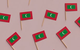 a table topped with red and green flags