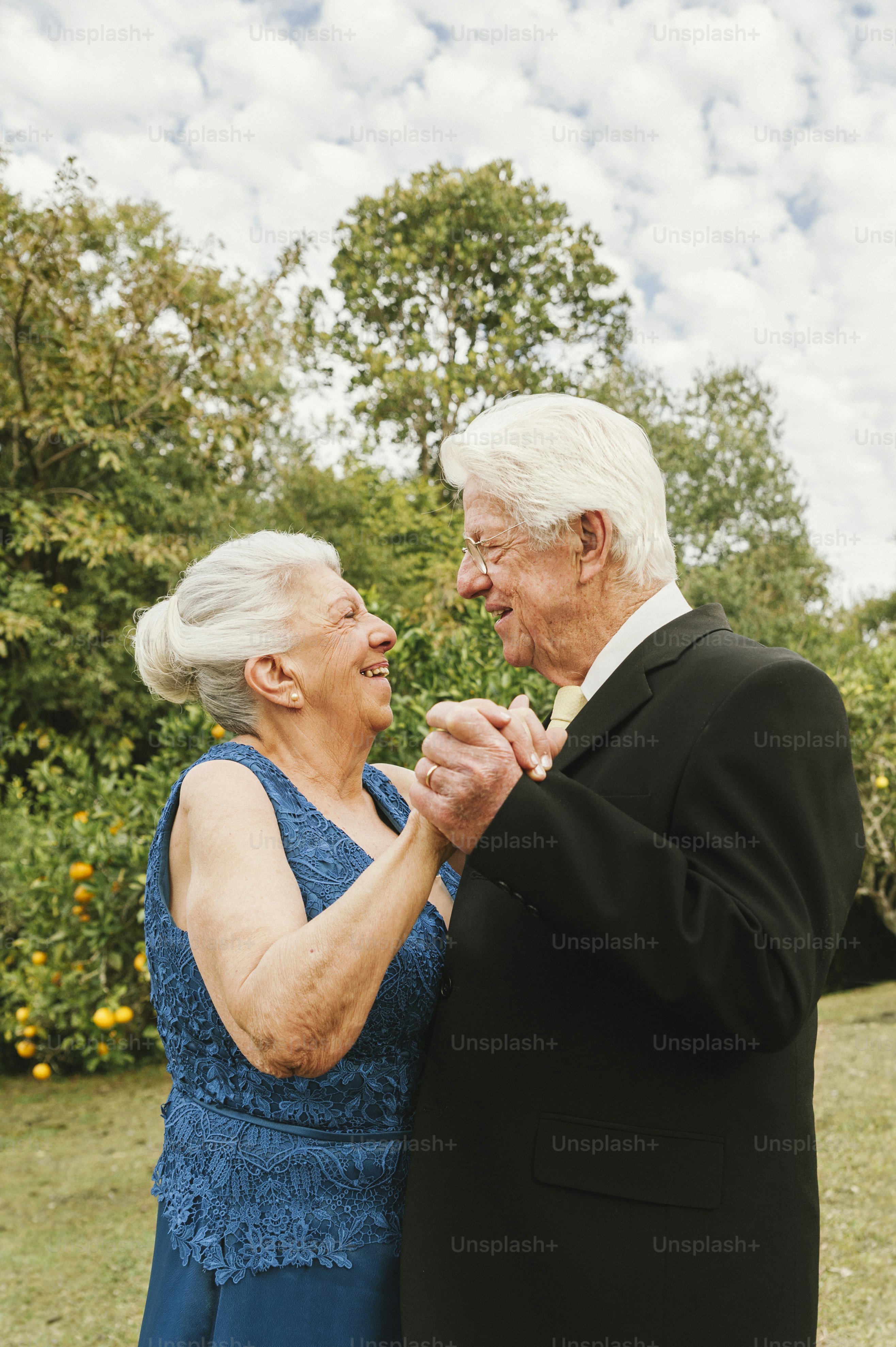 a couple of people that are standing in the grass