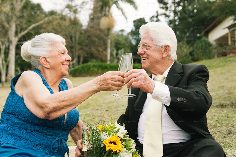 a man and woman toasting with a glass of wine