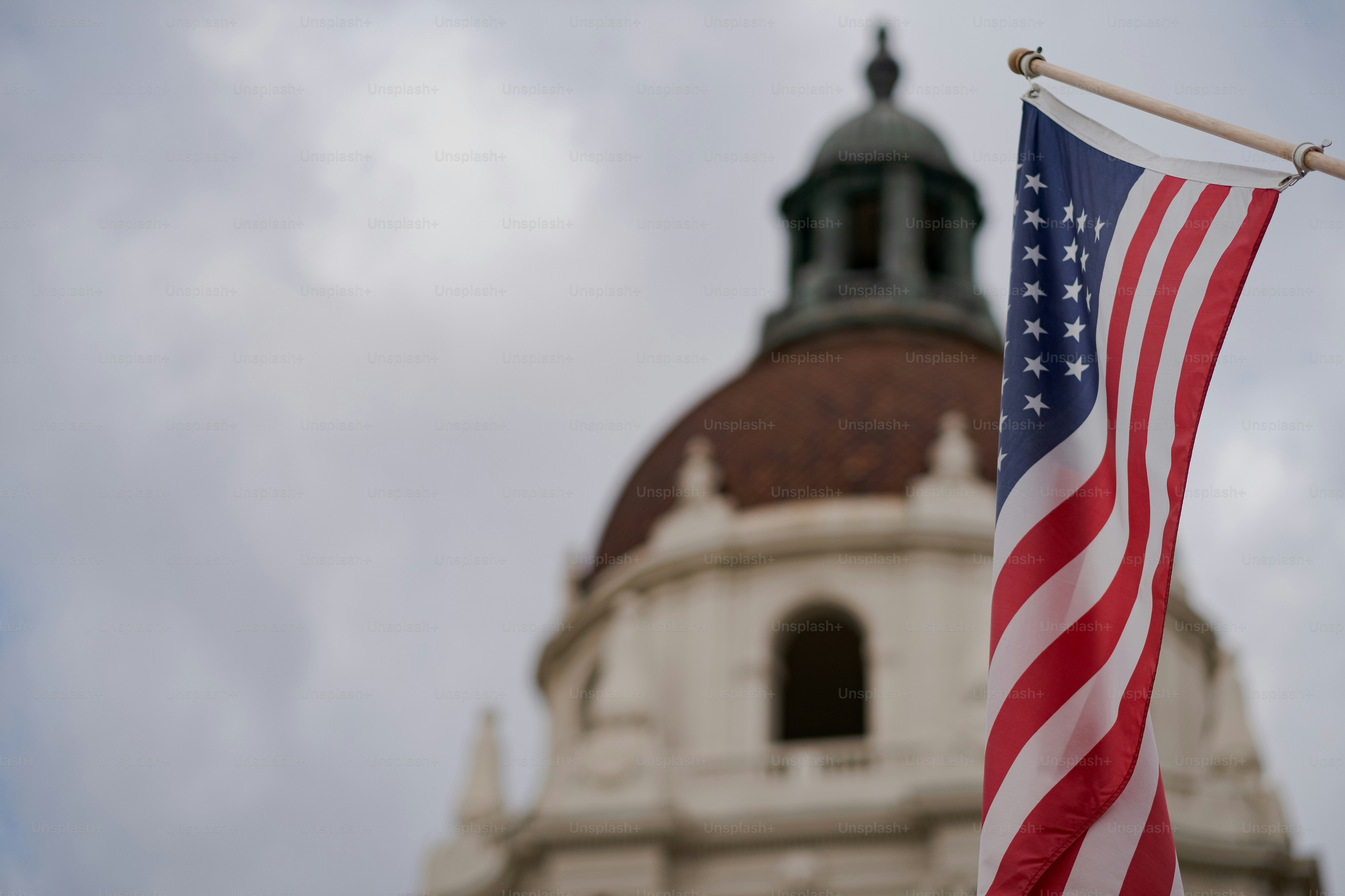 an american flag flying in front of a building