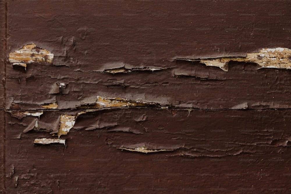 a rusted metal surface with peeling paint