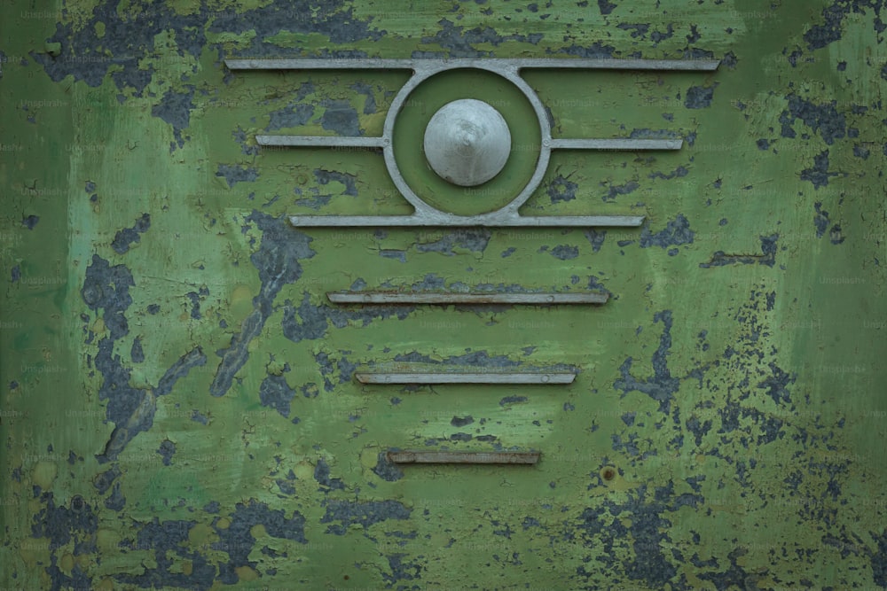 a close up of a green door with a metal handle