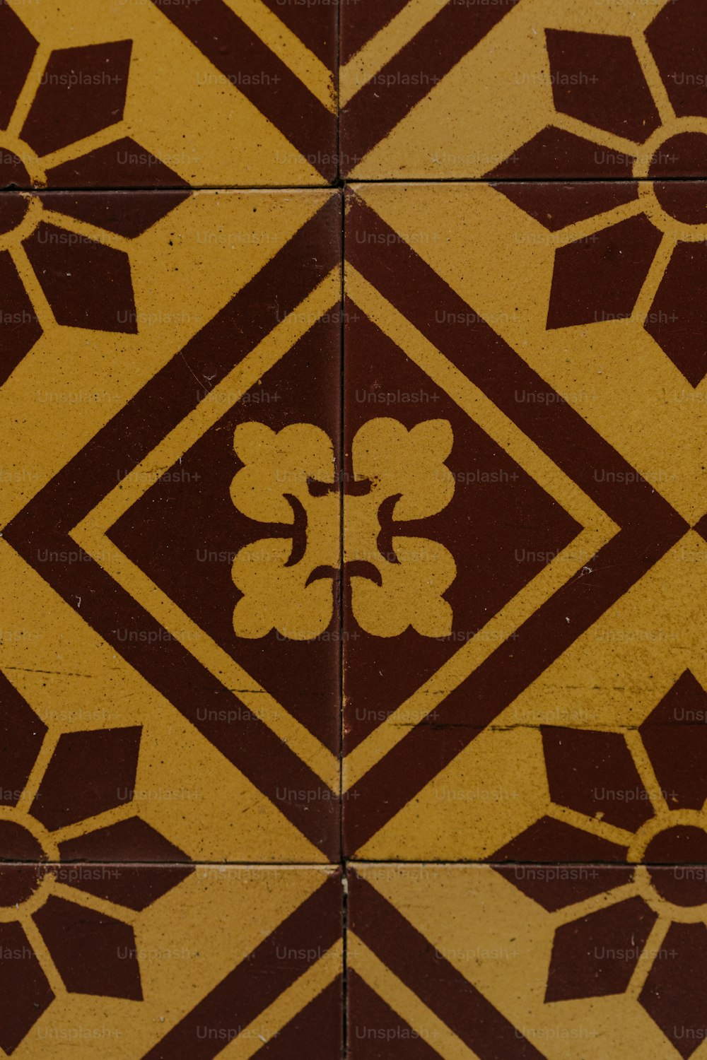 a close up of a tile with a design on it