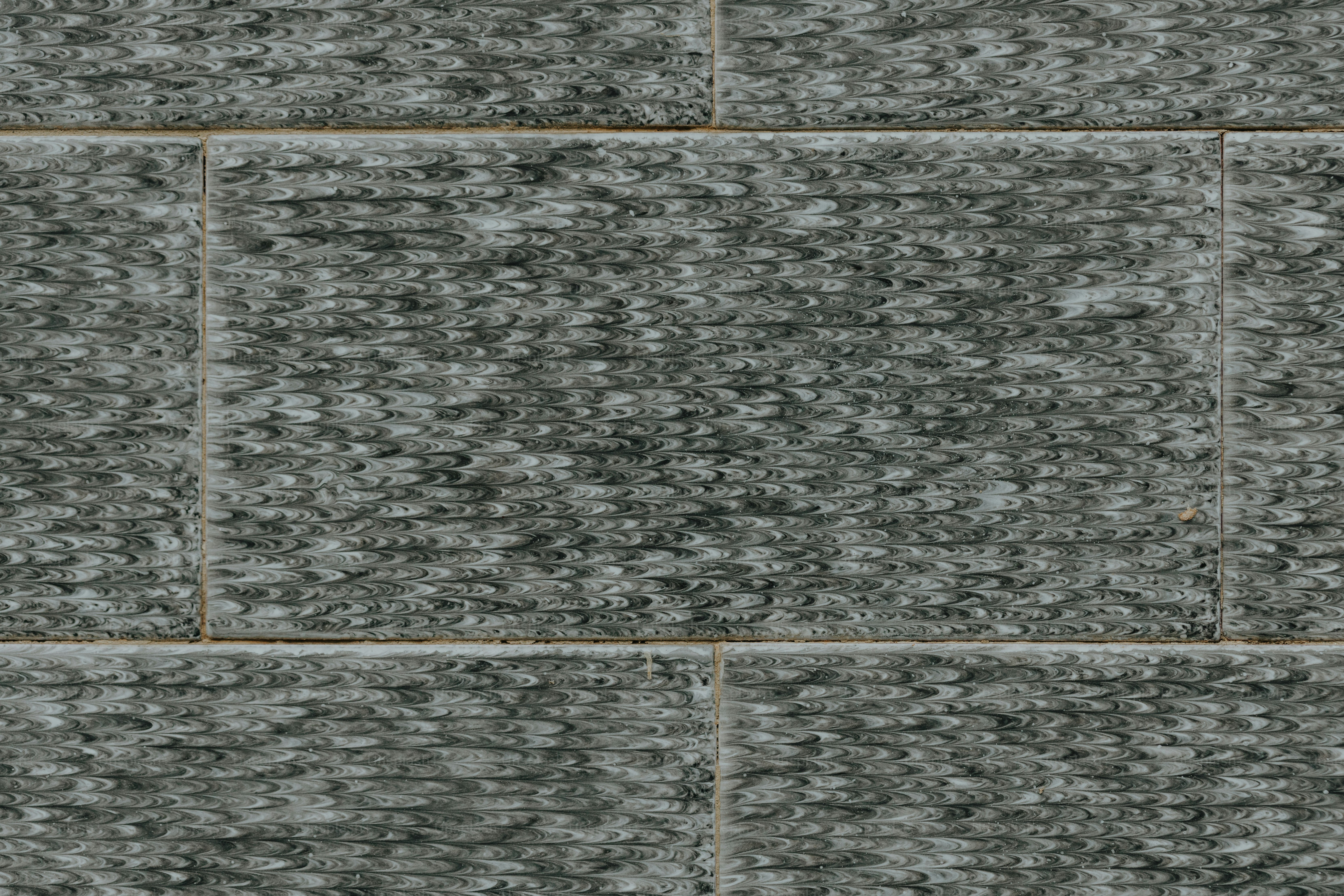 a black and white photo of a brick wall