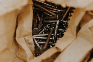 a bag filled with lots of screws and nails